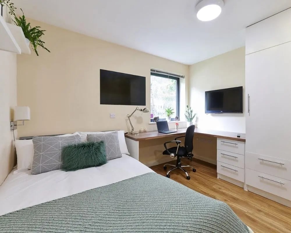Bed desk chair and TV bedroom at The Hub in London Student Accommodation