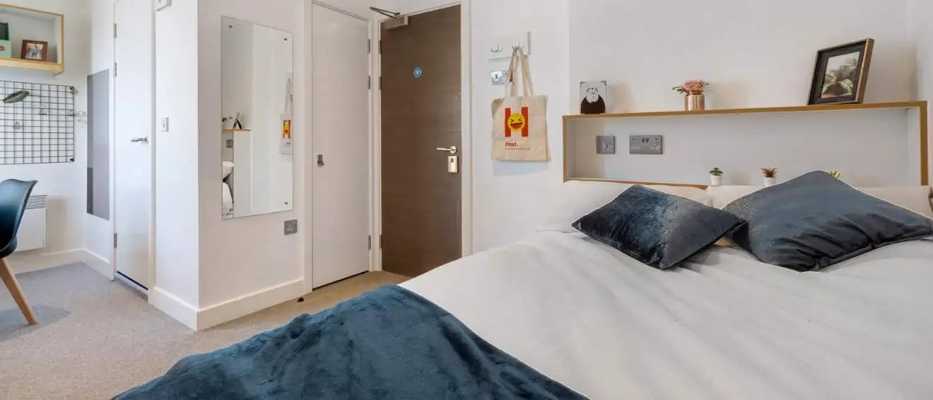 Bed pillows shelf bag picture bedroom at 27 Magdalen Street in Colchester Student Accommodation