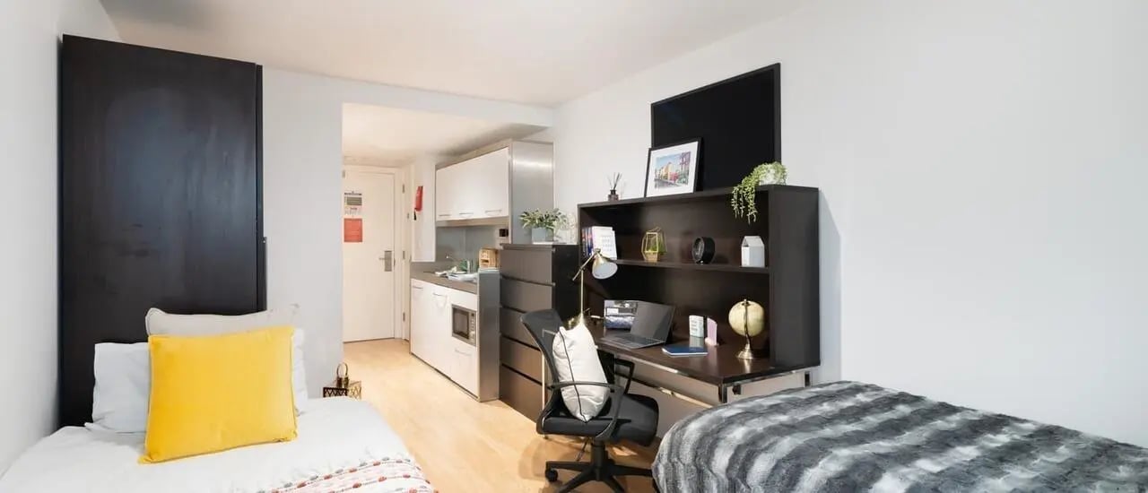 Beds desk kitchen and storage student studio at Chapter Portobello in London Student Accommodation