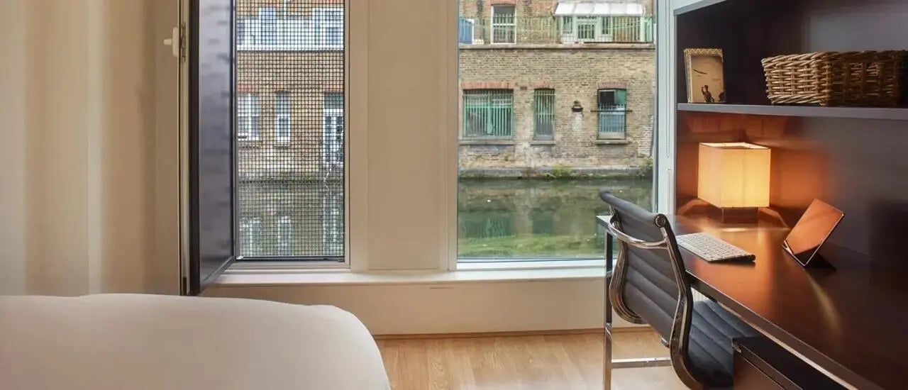 Bed study area with canal view bedroom at Chapter Portobello in London Student Accommodation