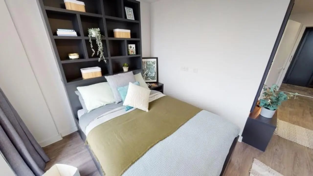 Bed with shelves and plants bedroom at iQ Shoreditch in London Student Accommodation