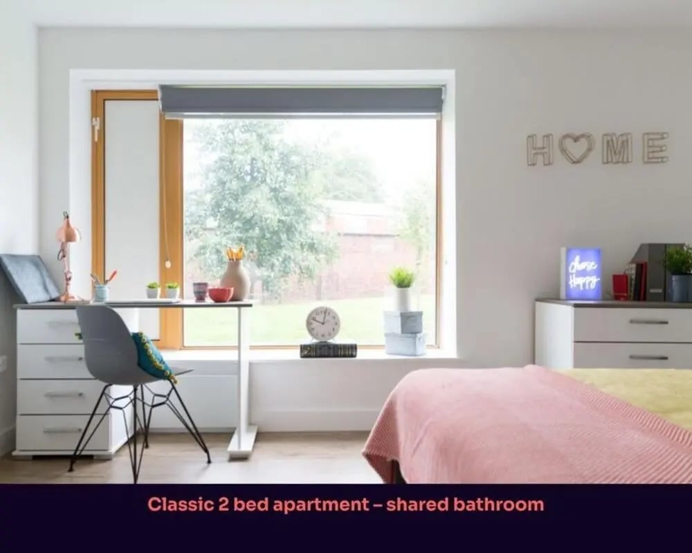Desk chair bed window with view bedroom at Victoria Point in Manchester Student Accommodation