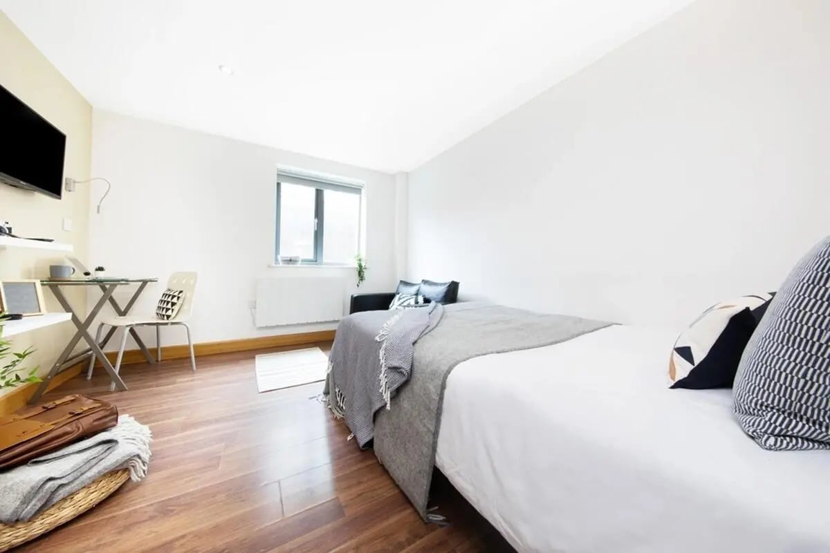 Bed desk chair and television bedroom at Grange Lane Apartments in Leicester Student Accommodation