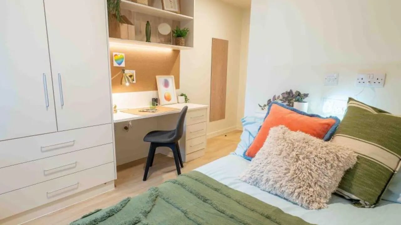 Desk wardrobe bed and pillows bedroom at Longwood Place in Coventry Student Accommodation