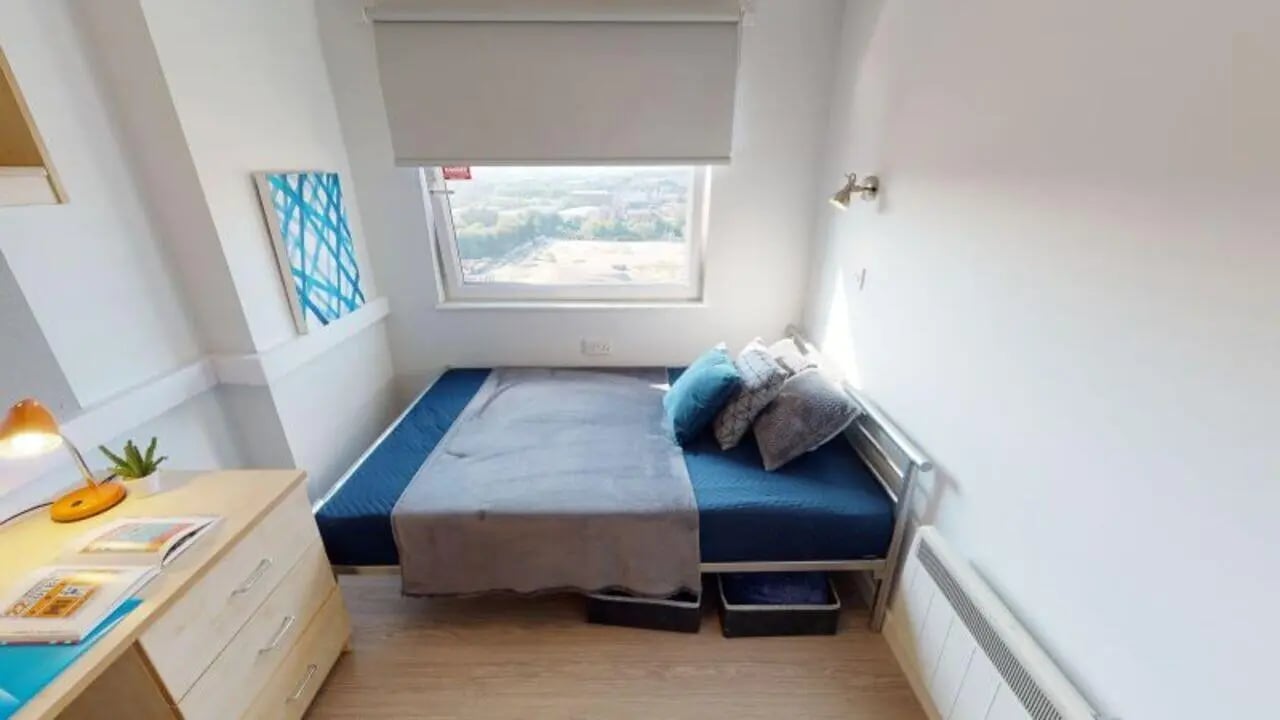 Bed desk and window in student bedroom at iQ Marsden House in Leeds Student Accommodation