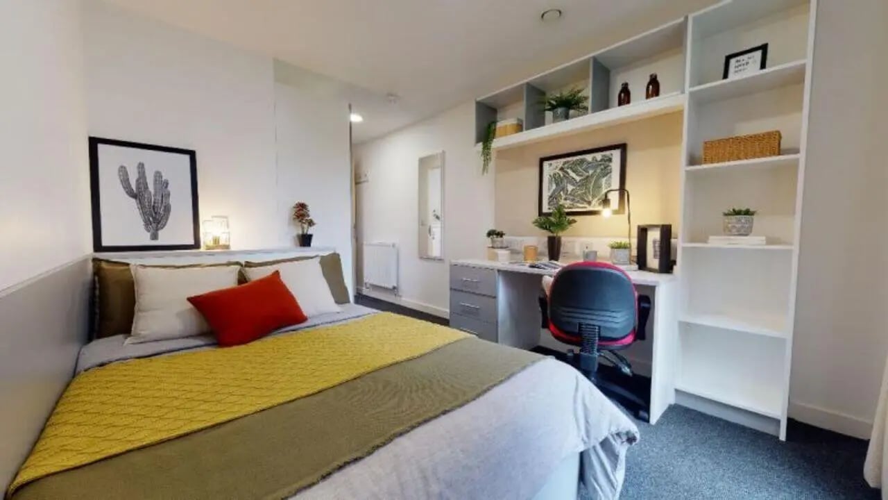 Bed desk chair and shelves bedroom at iQ Century Square in Sheffield Student Accommodation