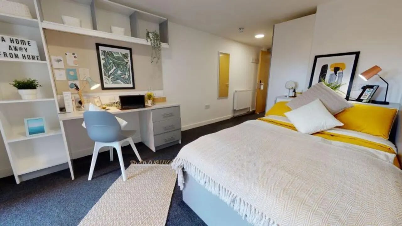 Desk bed and shelves student accommodation bedroom at iQ Century Square in Sheffield Student Accommodation