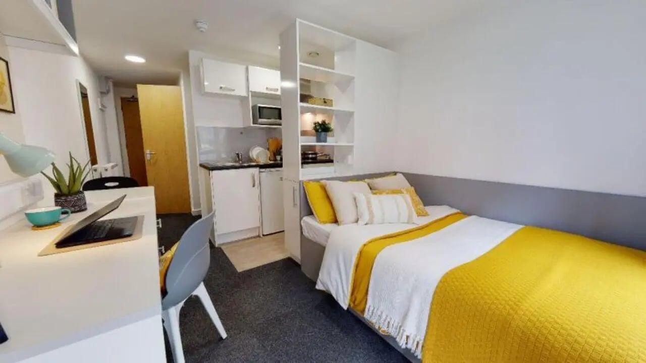 Bed desk kitchen shelves studio apartment at iQ Century Square in Sheffield Student Accommodation