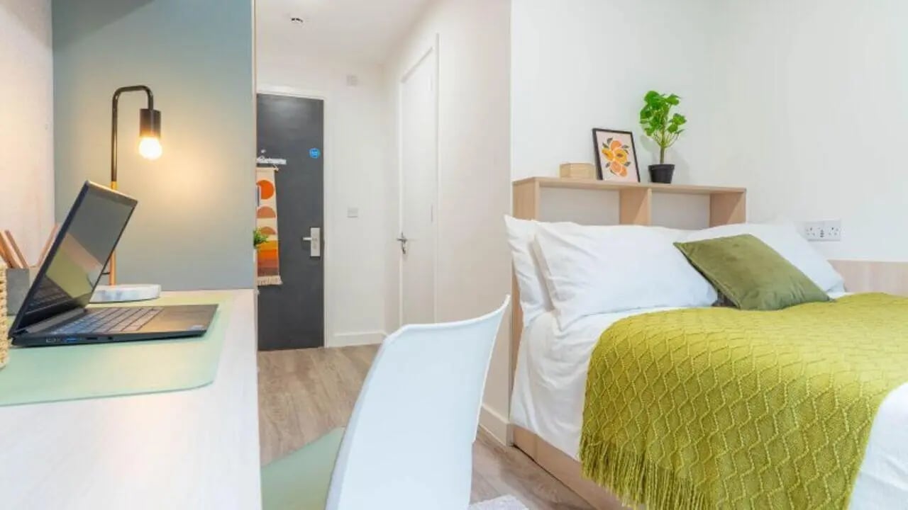 Desk laptop chair bed with green throw Bedroom at iQ Signal Place in Nottingham Student Accommodation