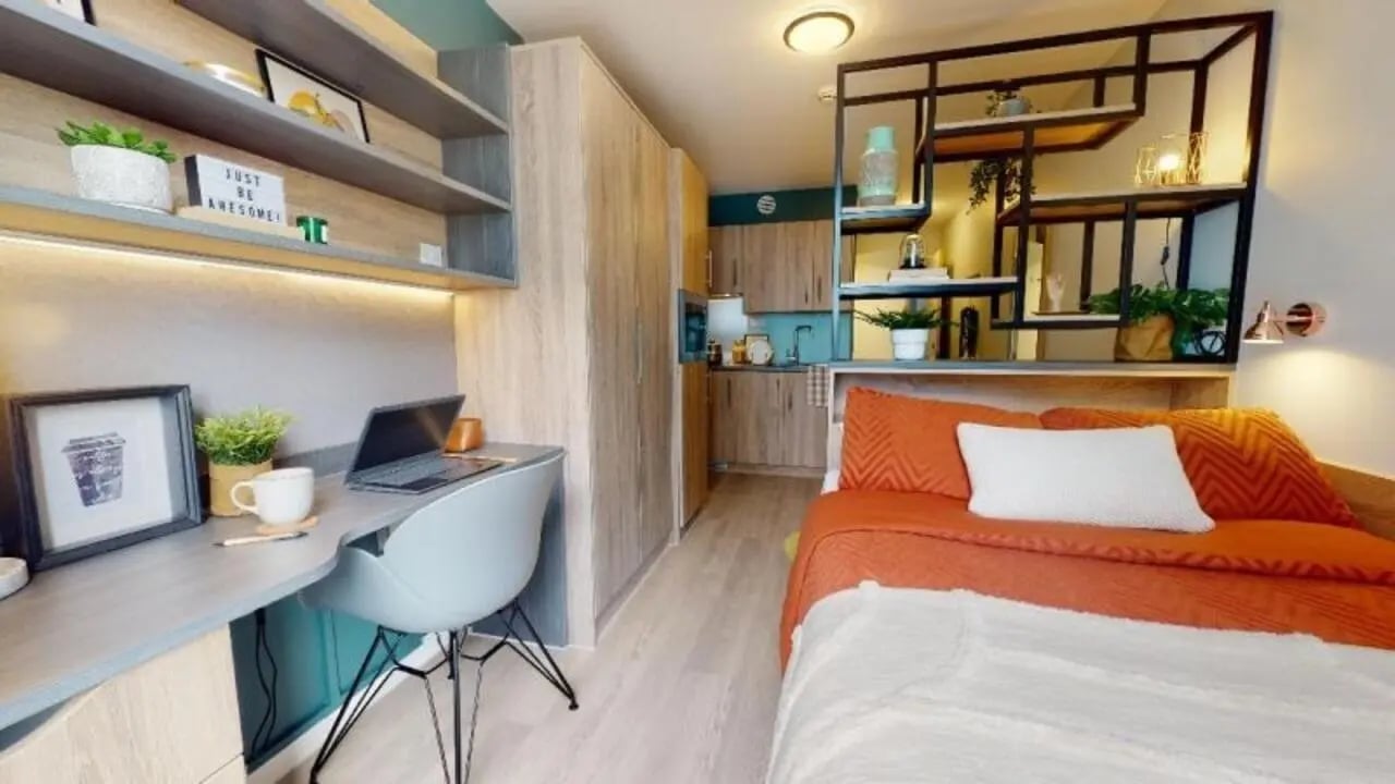 Desk bed and kitchen studio apartment at iQ Hammersmith in London Student Accommodation