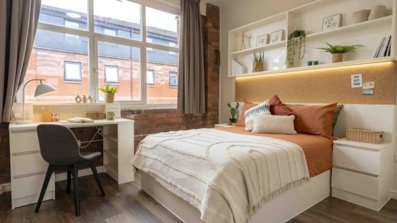 Bed desk shelves and window bedroom at iQ Fletcher House in Manchester Student Accommodation