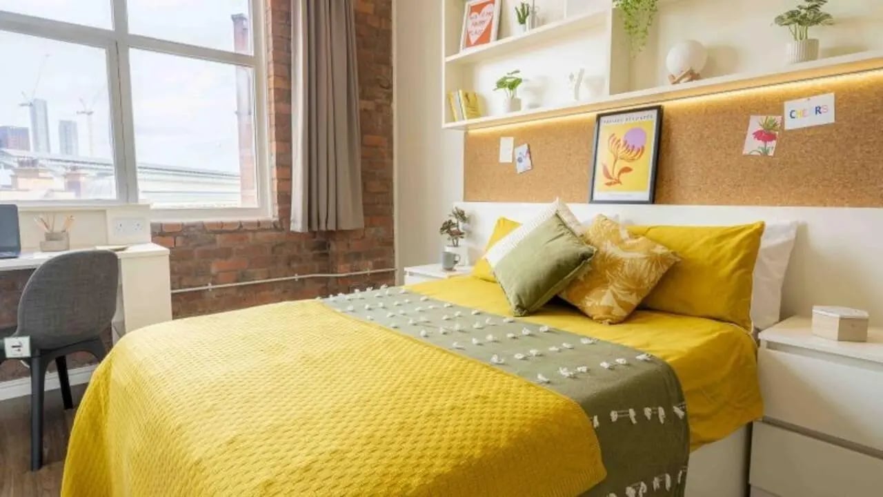 Bed desk chair and window view bedroom at iQ Fletcher House in Manchester Student Accommodation