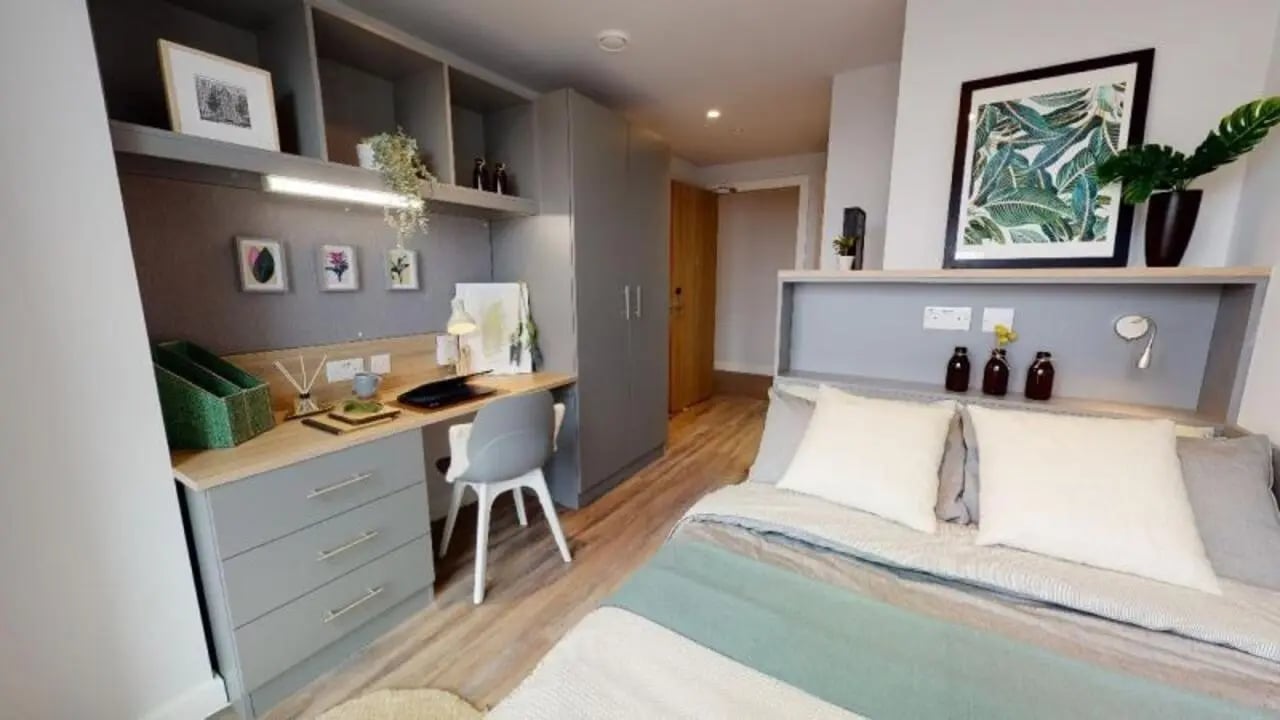 Desk chair plant framed art bed bedroom at iQ Altus House in Leeds Student Accommodation