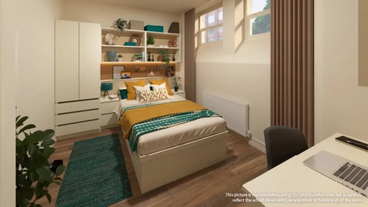 Bed wardrobe shelves laptop desk bedroom at iQ Hollingworth House in Manchester Student Accommodation