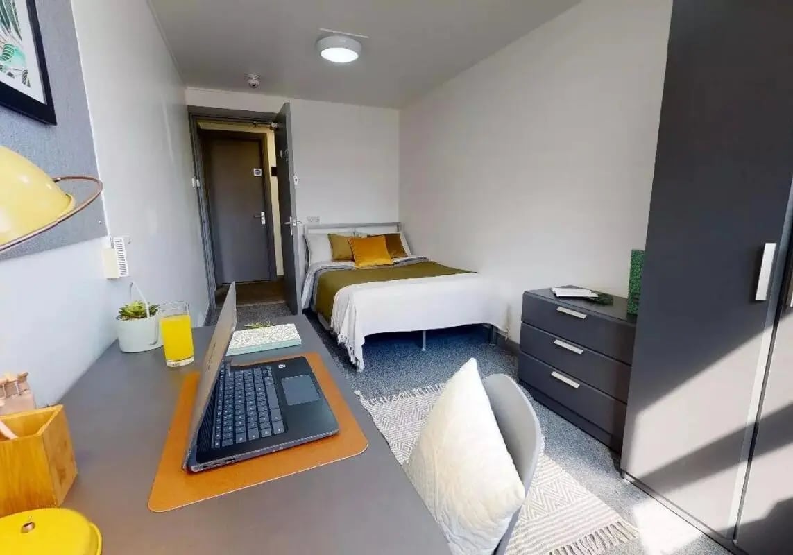 Bed desk chair and wardrobe bedroom at iQ Stephenson House in Newcastle Upon Tyne Student Accommodation