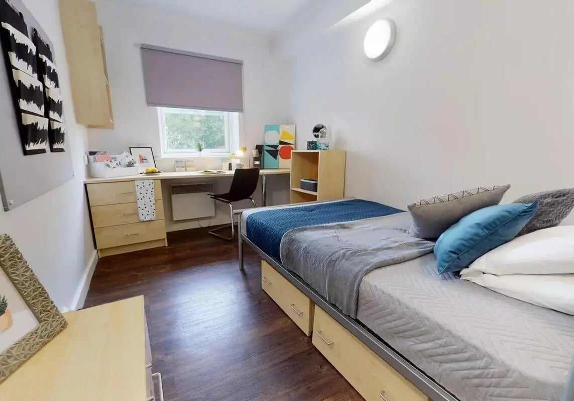 Bed desk and chair student bedroom at iQ Wilmslow Park in Manchester Student Accommodation
