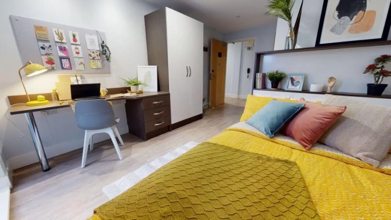 Desk chair laptop and bed bedroom at iQ Penworks House in Birmingham Student Accommodation