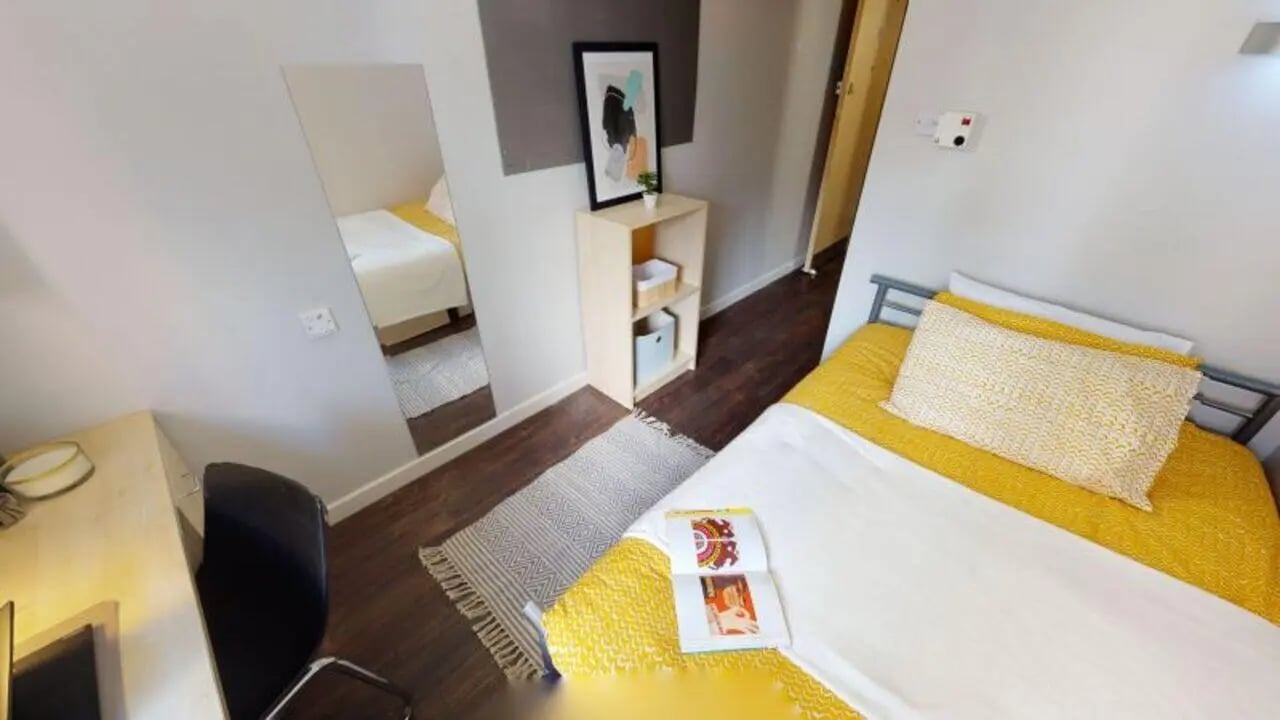 Bed desk mirror and bookshelf bedroom at iQ Great Newton House in Liverpool Student Accommodation