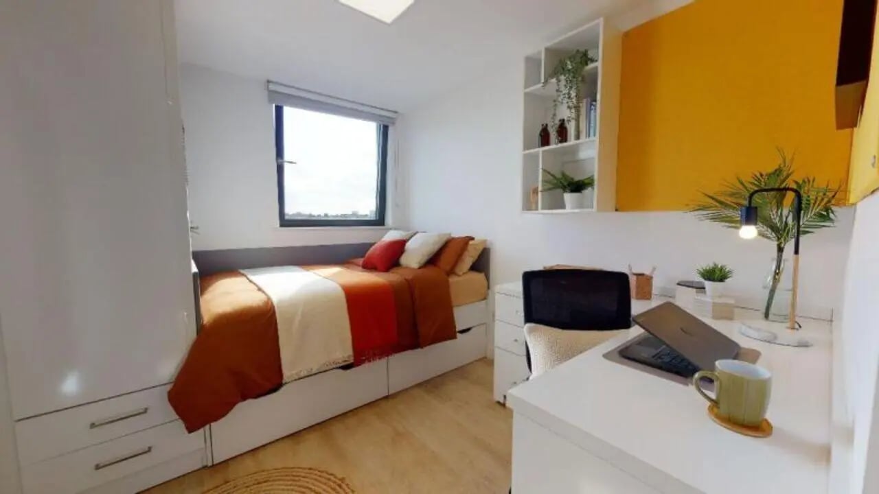 Bed desk window and shelves bedroom at iQ Haywood House in London Student Accommodation