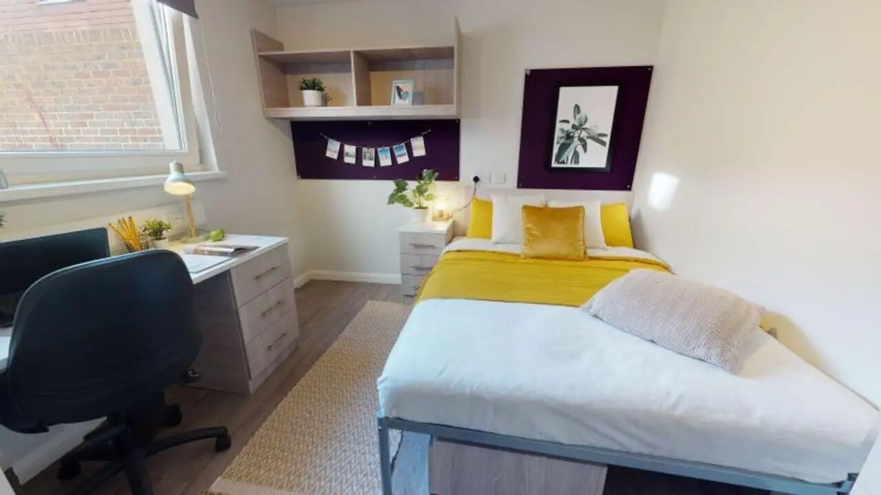 Desk chair bed shelving artwork bedroom at iQ Sawmills in Brighton Student Accommodation