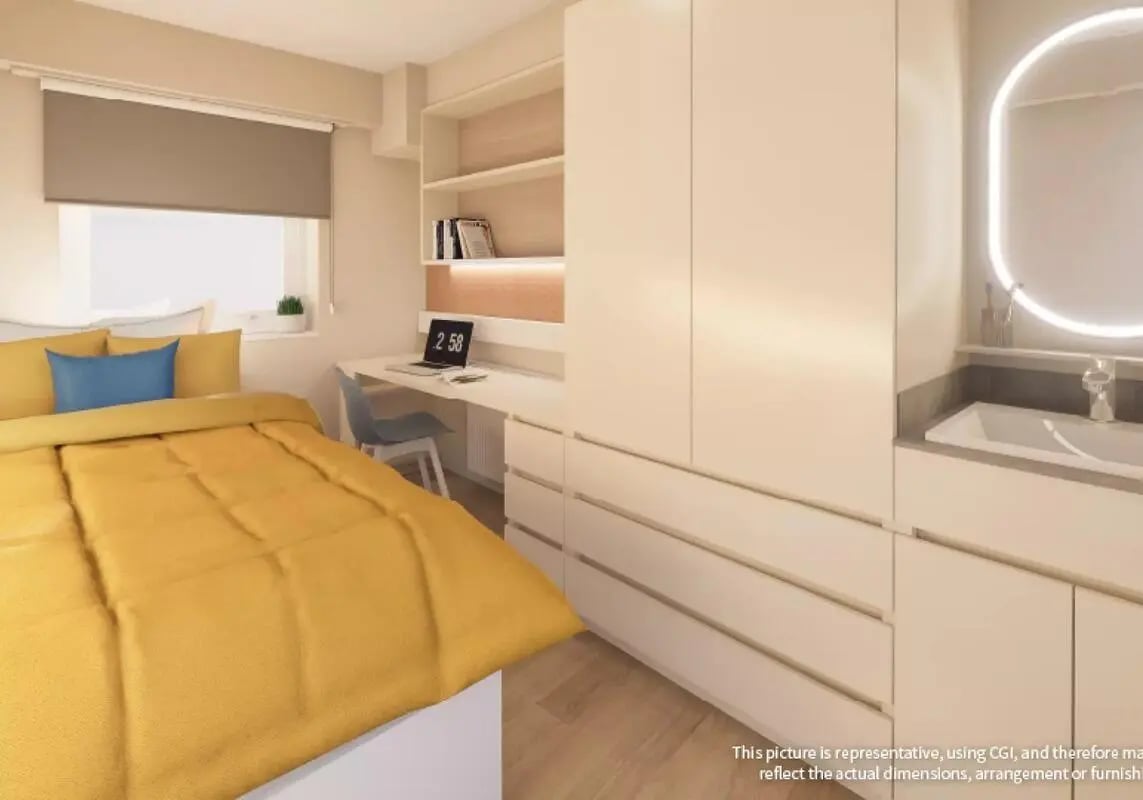 Bed desk laptop large wardrobe sink bathroom living room at iQ The Arcade in London Student Accommodation