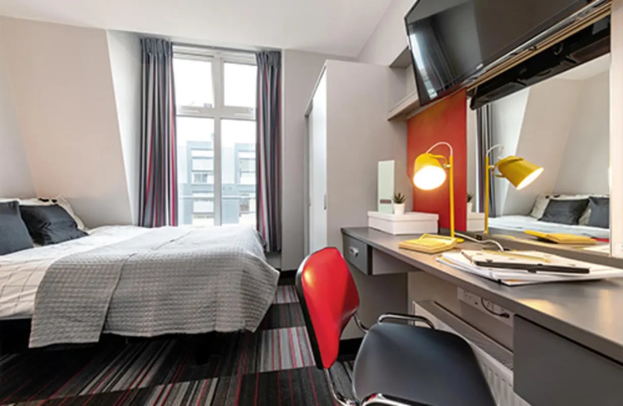 Bed desk chair and TV bedroom study area at Pillar Box in Coventry Student Accommodation