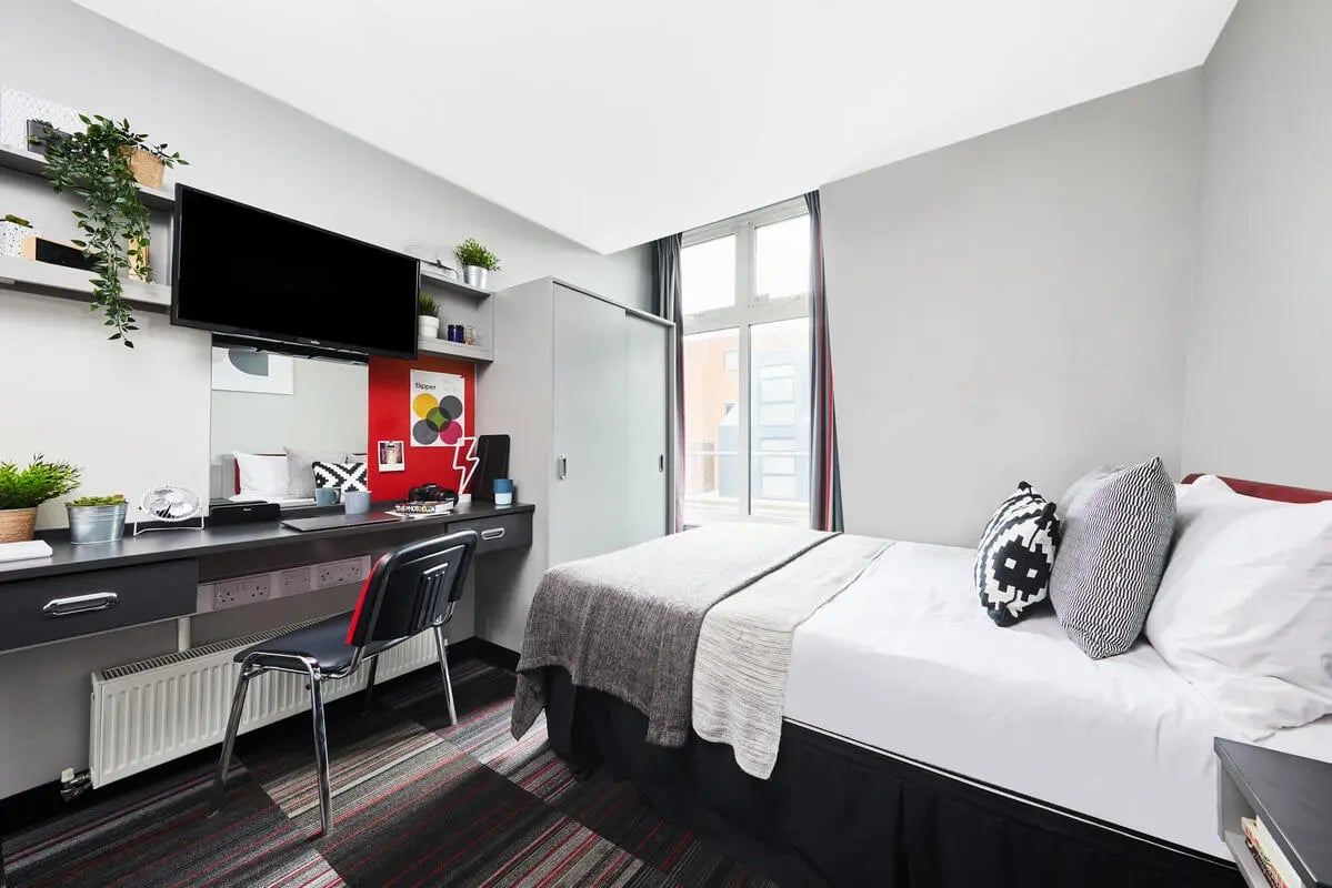 Bed desk chair television and wardrobe bedroom at Pillar Box in Coventry Student Accommodation