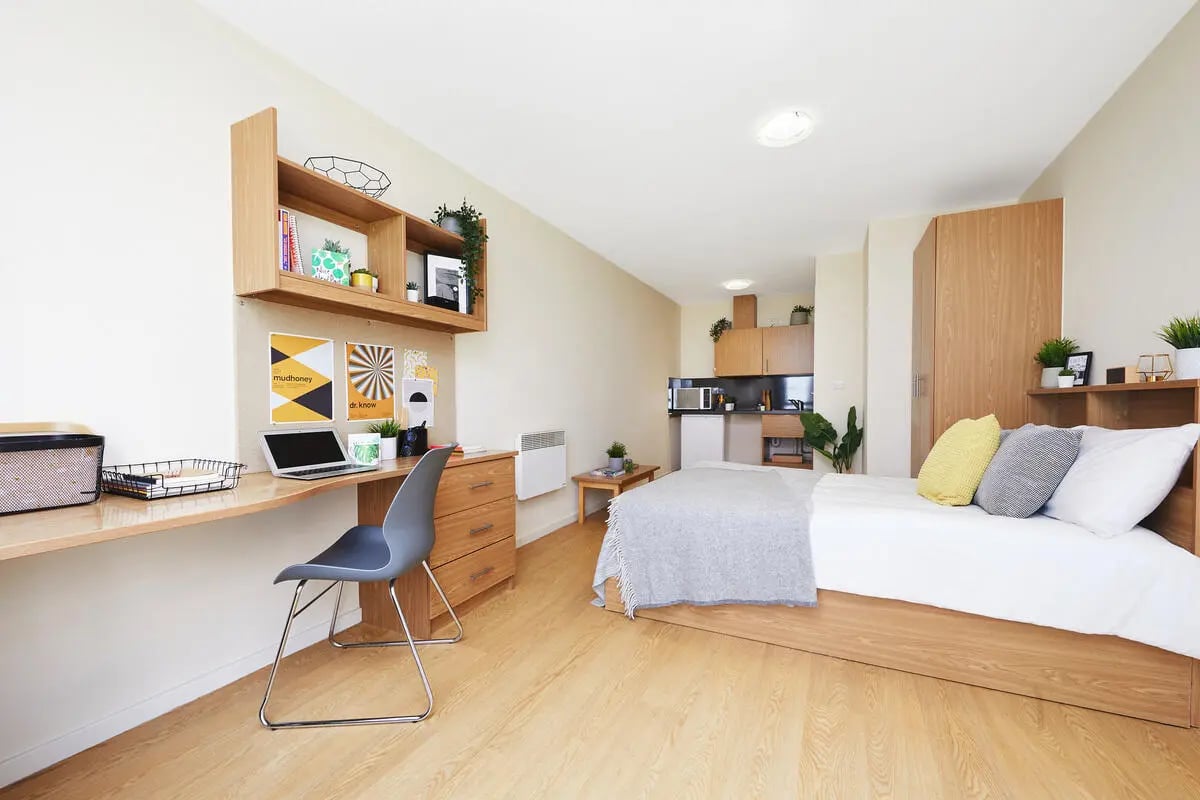 Desk bed kitchen storage study area bedroom at Collegiate Athena Hall in Ipswich Student Accommodation
