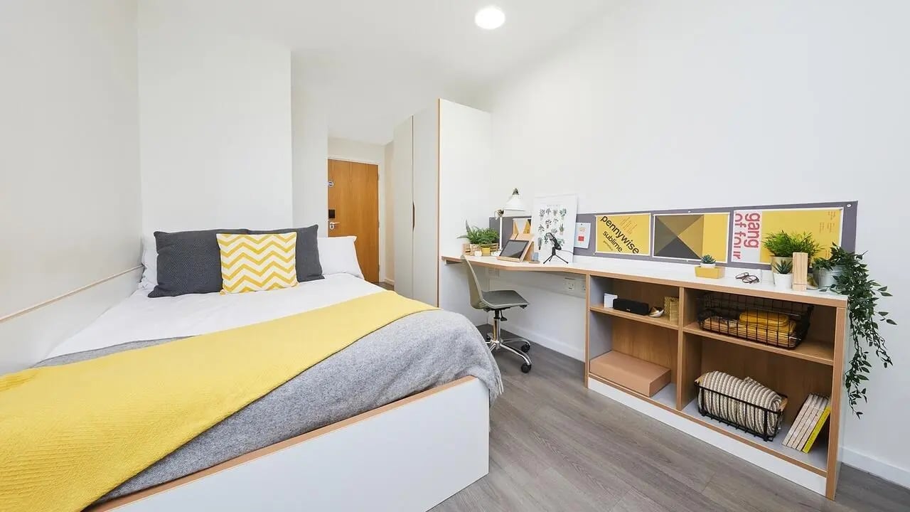 Bed desk wardrobe and shelving unit bedroom at Collegiate Merlin Heights in Leicester Student Accommodation