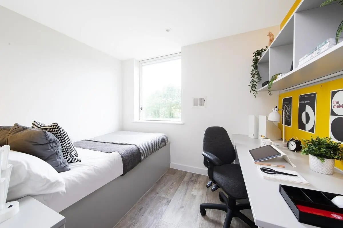 Bed desk chair window and shelves bedroom at Collegiate Cathedral Point in Winchester Student Accommodation
