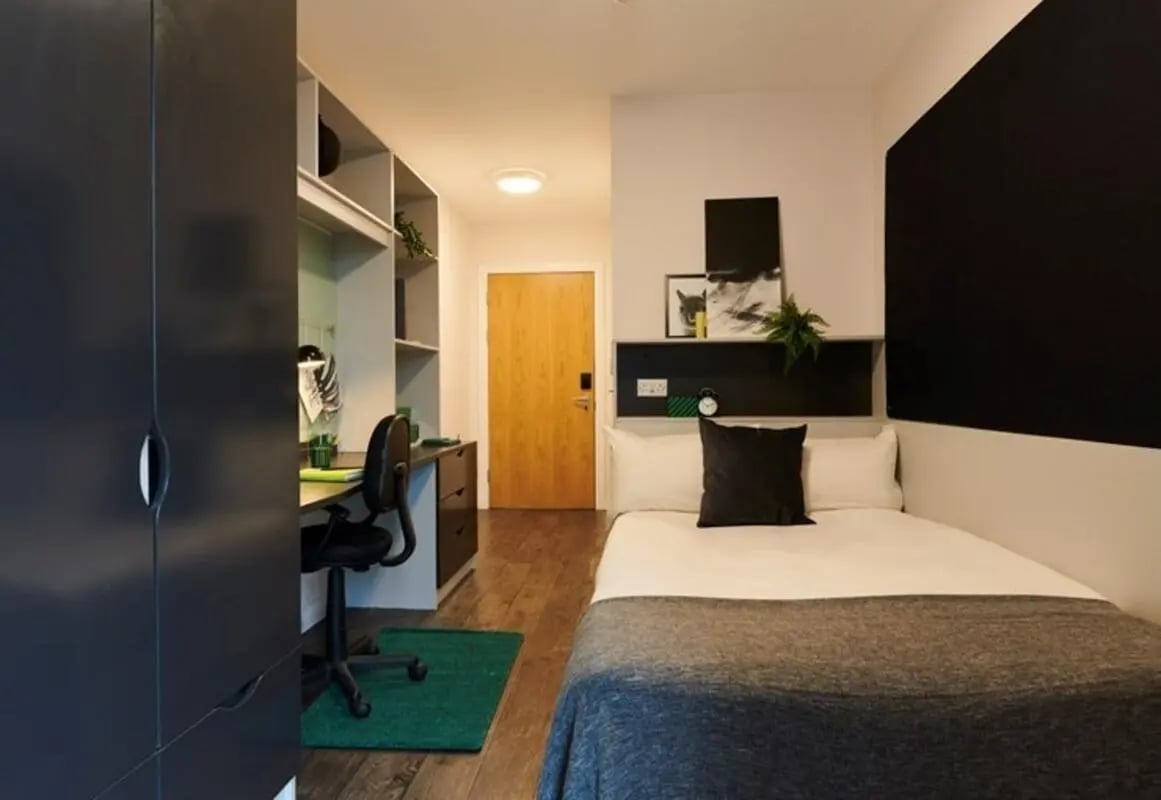 Wardrobe desk chair bed shelves door Bedroom at Binary Hub in Dublin Student Accommodation