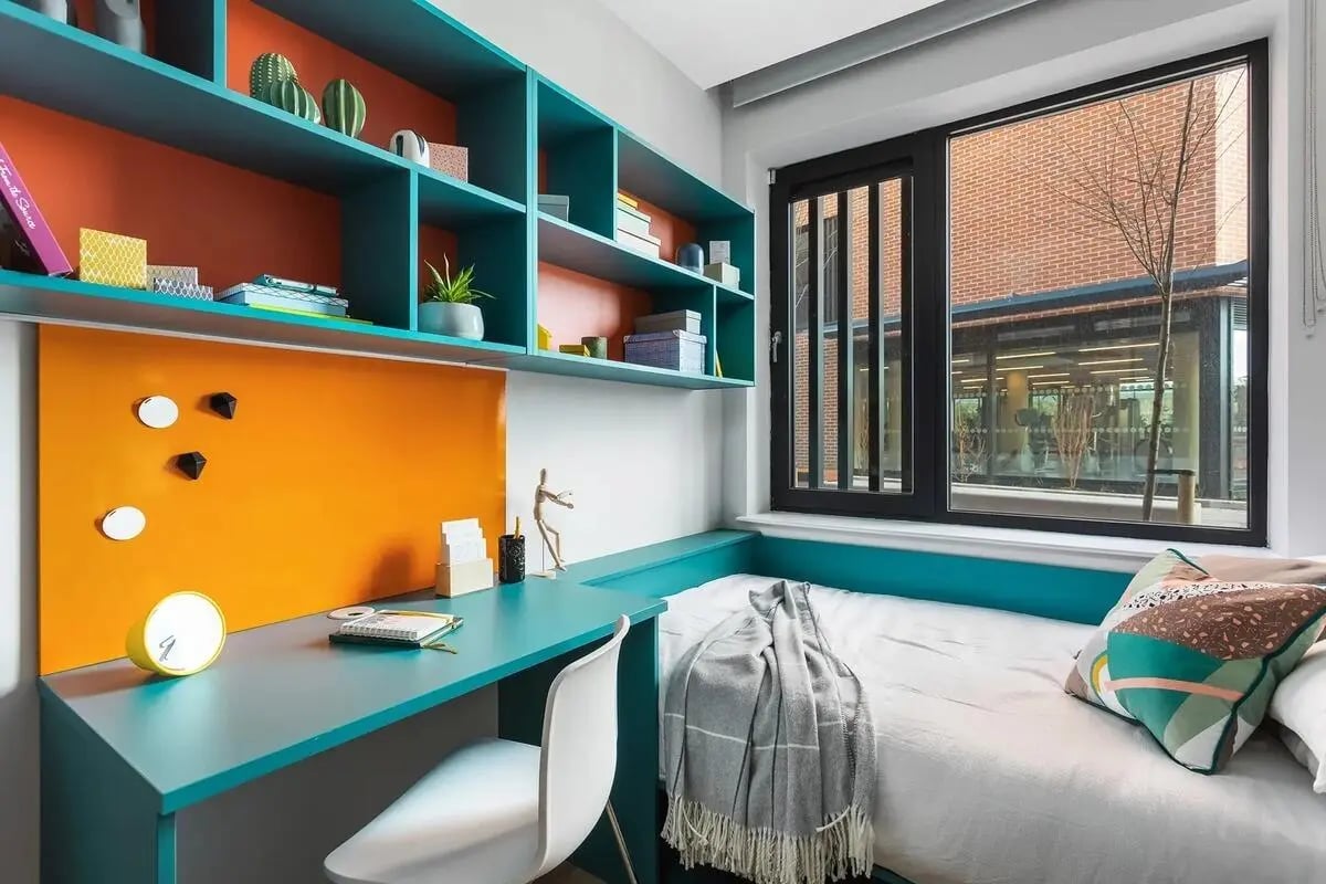 Bed desk shelves pillows and window bedroom at Highfield House in Dublin Student Accommodation