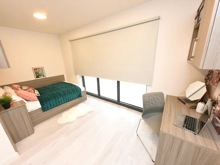 Bed desk chair rug bedroom at Melbourn Point in Cork Student Accommodation