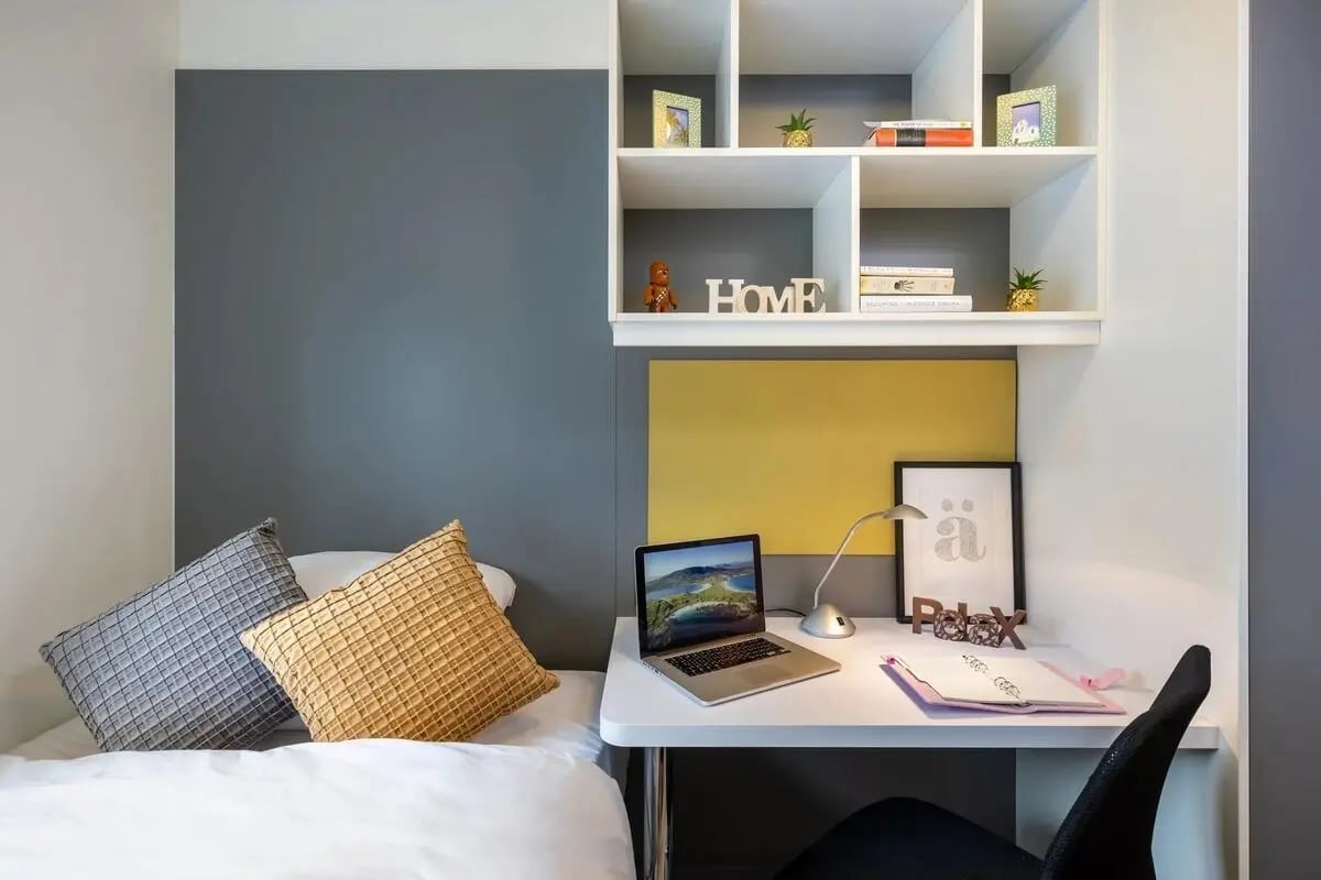 Bed desk laptop shelf with books study area at Cuirt na Coiribe in Galway Student Accommodation
