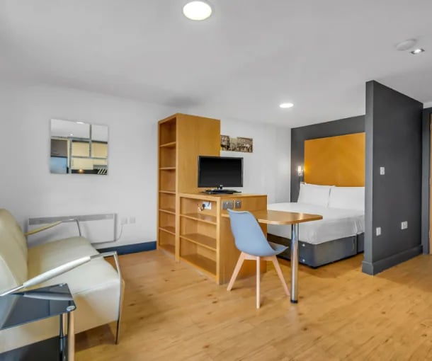 Sofa bed desk shelving unit television bedroom living area at Iconinc Leeds City West in Leeds Student Accommodation