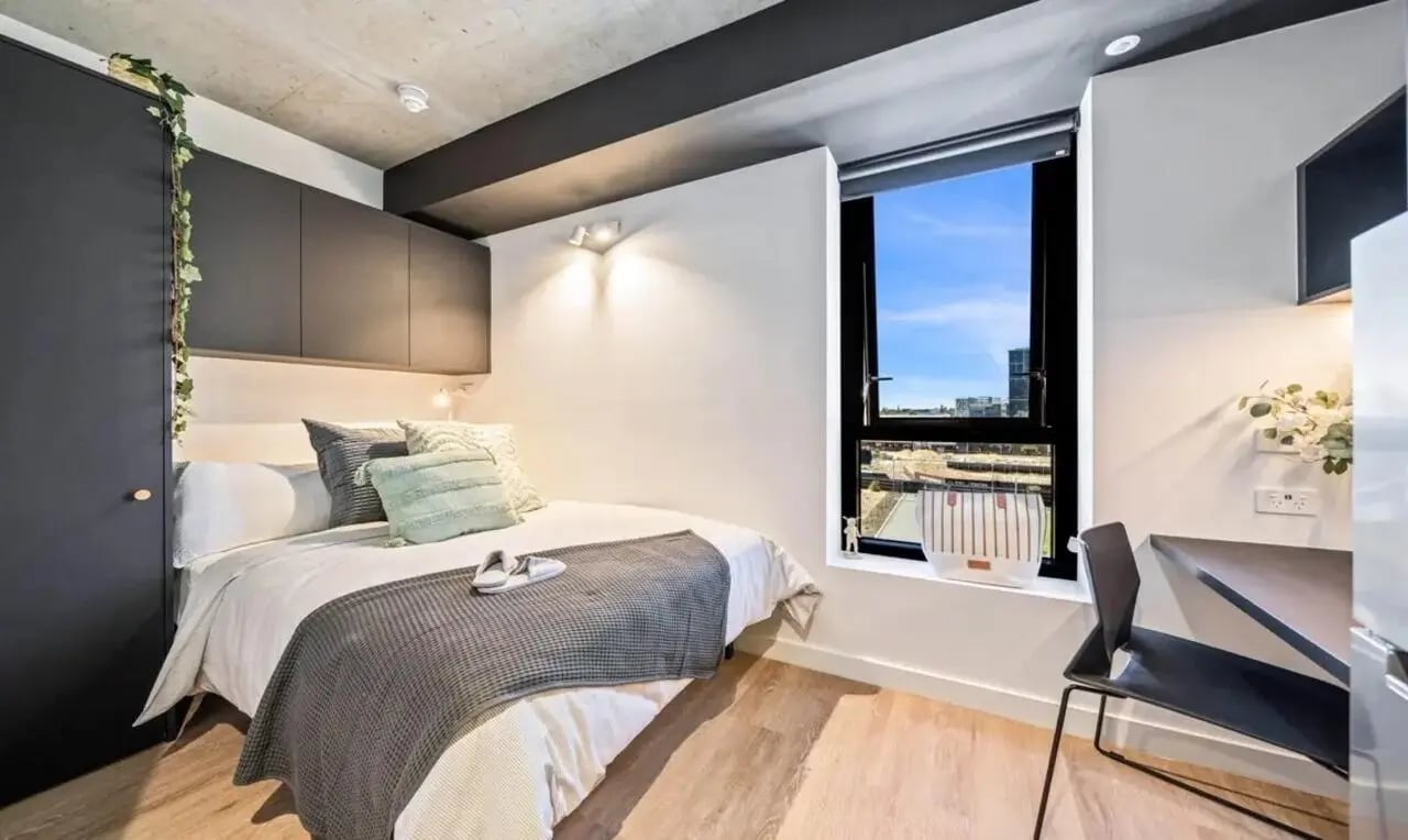 Bed wardrobe and study desk Bedroom at Perth Central in Perth Student Accommodation