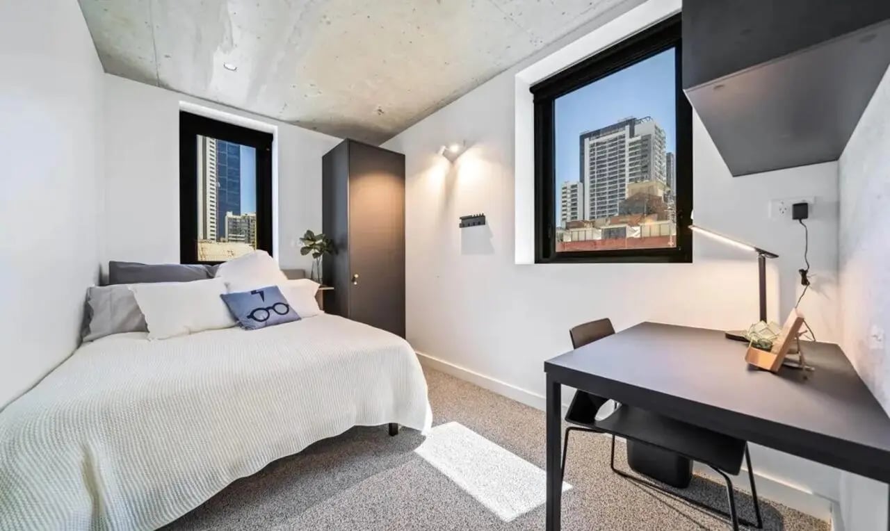 Bed desk closet with cityscape view bedroom at Perth Central in Perth Student Accommodation