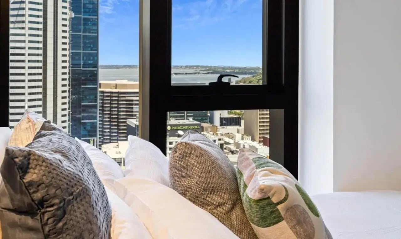 Pillows on bed with city view bedroom at Perth Central in Perth Student Accommodation