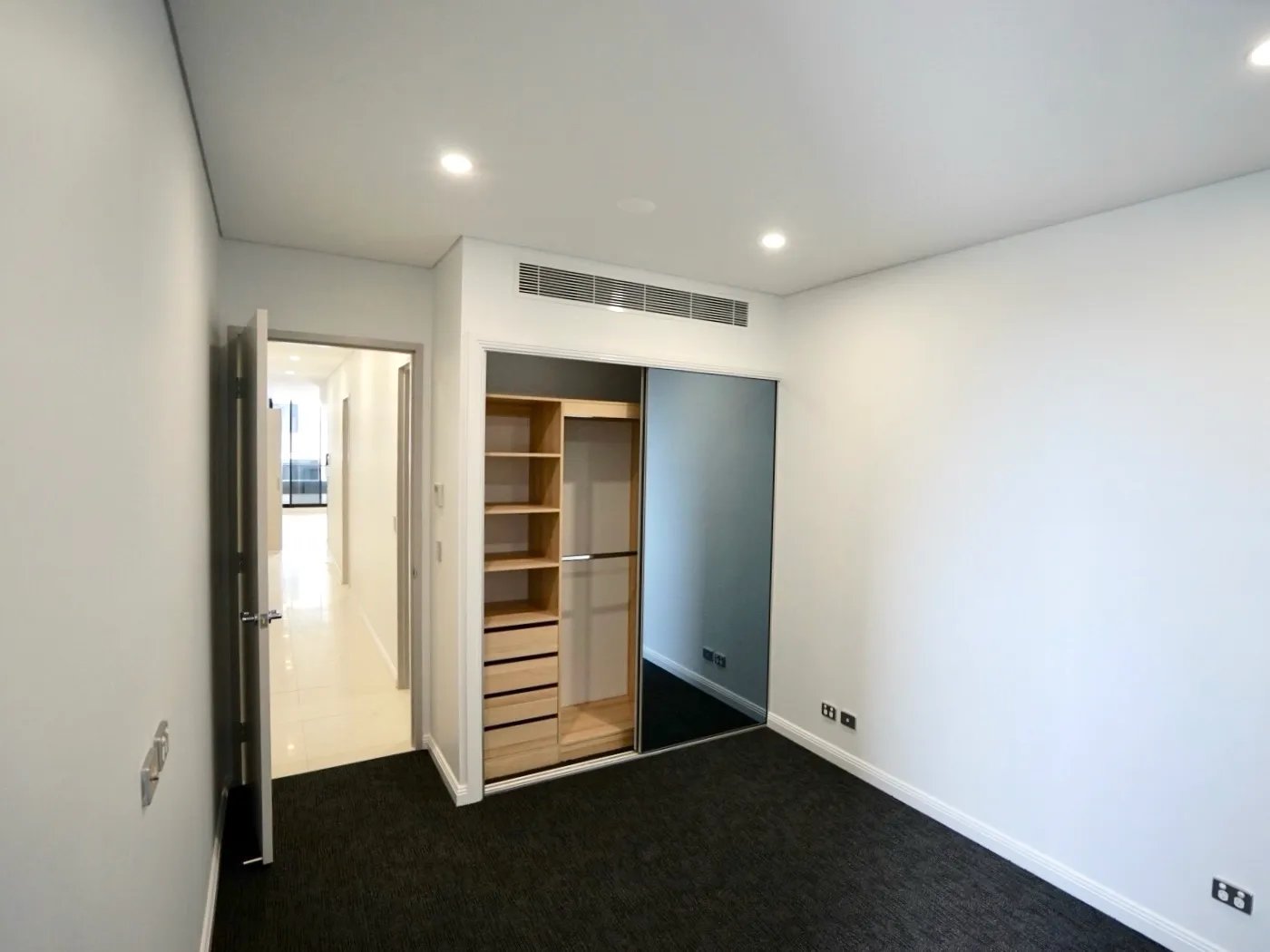 Wardrobe and hallway visible bedroom at Belong Rosebery in Sydney Student Accommodation