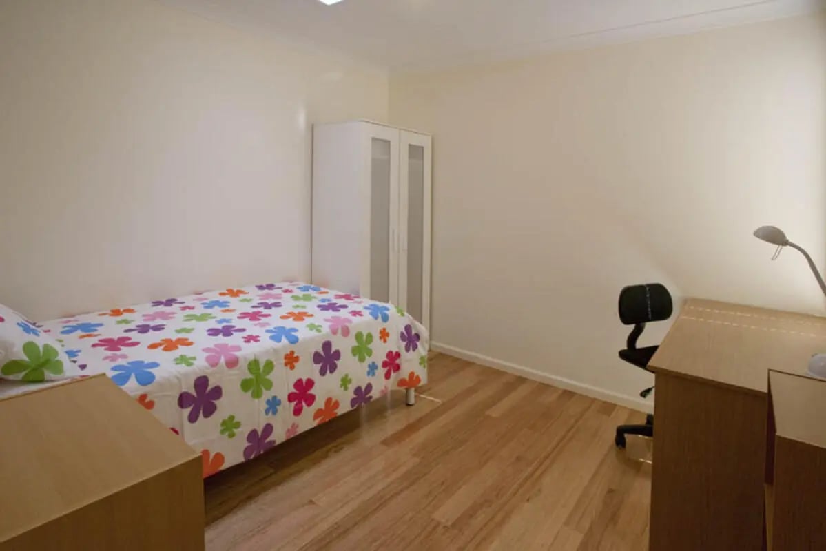 Bed desk wardrobe study area bedroom at Sunset House in Melbourne Student Accommodation