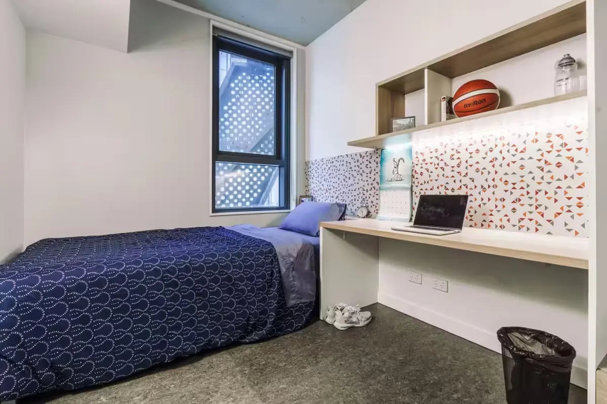 Bed desk laptop basketball wall art window bedroom at Student One Elizabeth Street in Brisbane Student Accommodation
