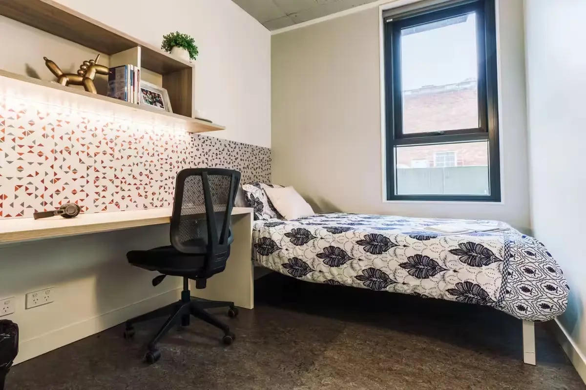 Bed desk chair shelf with decor bedroom at Student One Elizabeth Street in Brisbane Student Accommodation