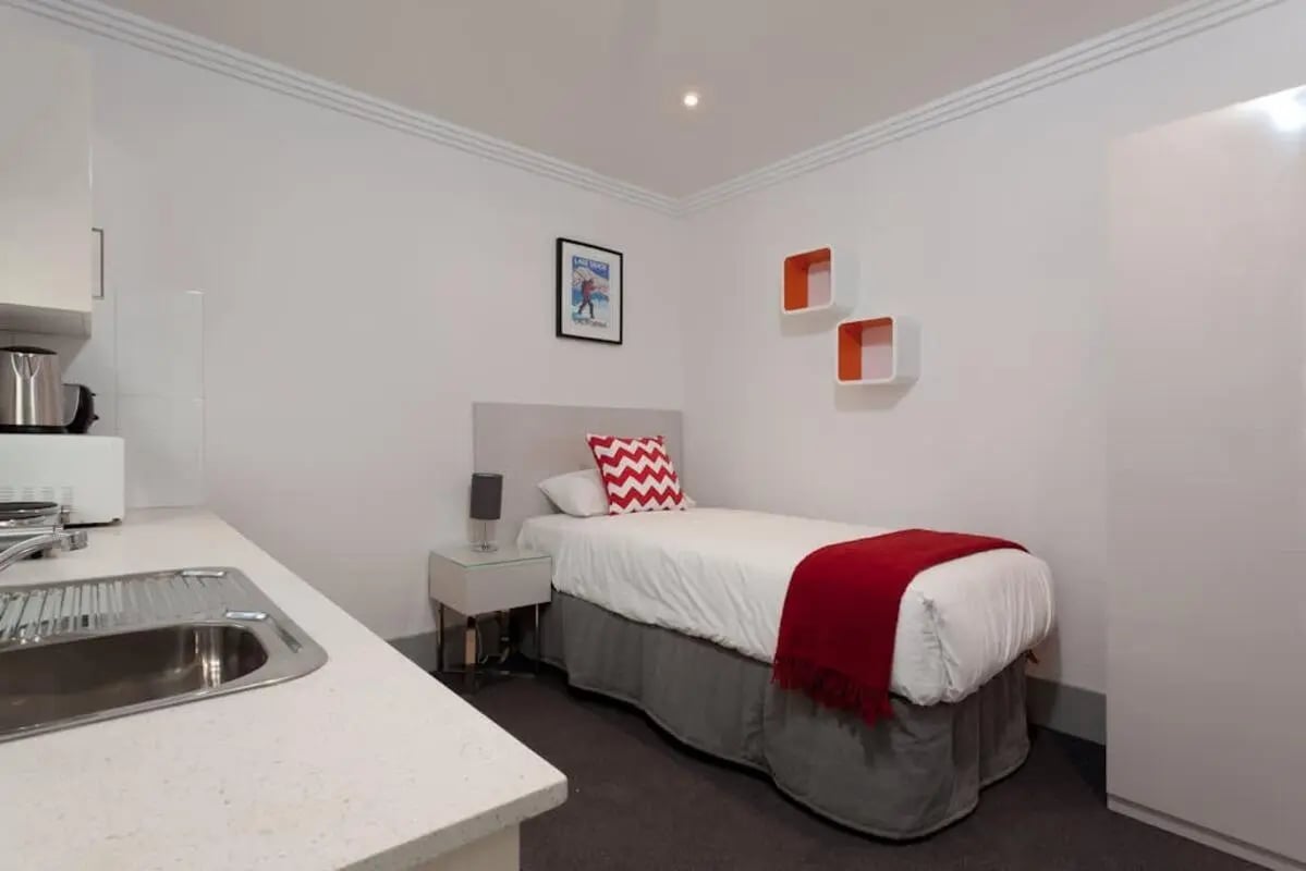 Bed microwave sink and shelves bedroom at ume Darlinghurst in Sydney Student Accommodation