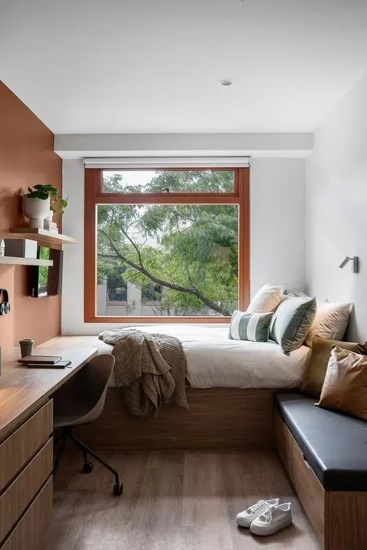 Desk bed window green trees bedroom at Campus House in Melbourne Student Accommodation