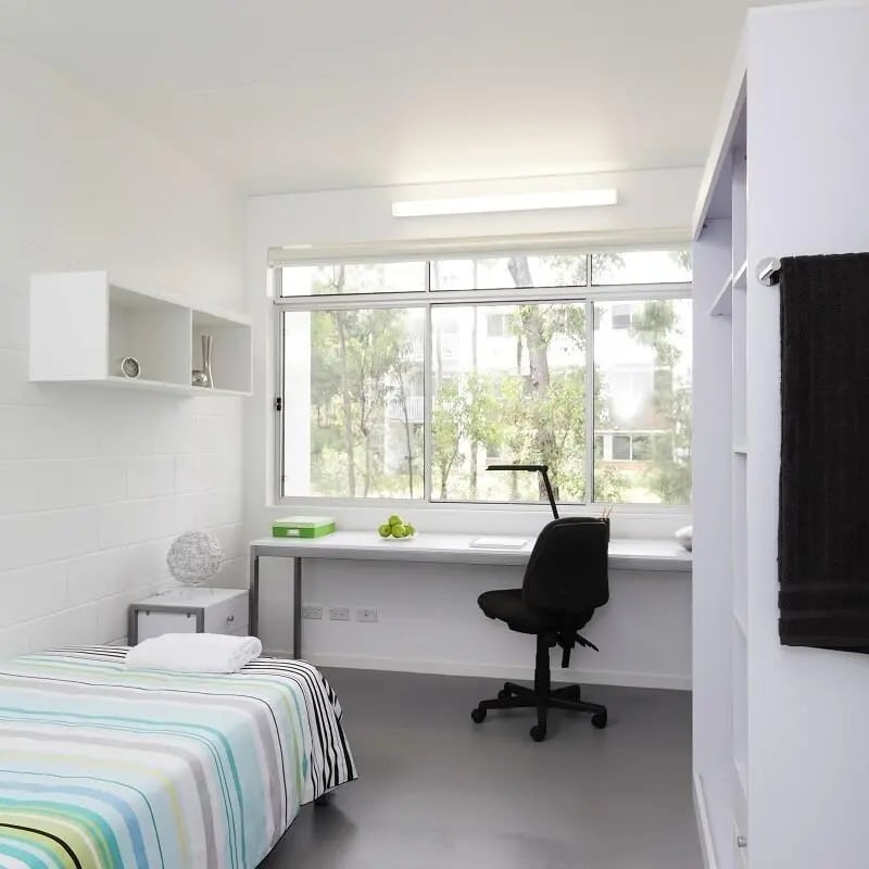 Bed desk chair shelves window study area bedroom at Griffith University Village Gold Coast in Gold Coast Student Accommodation