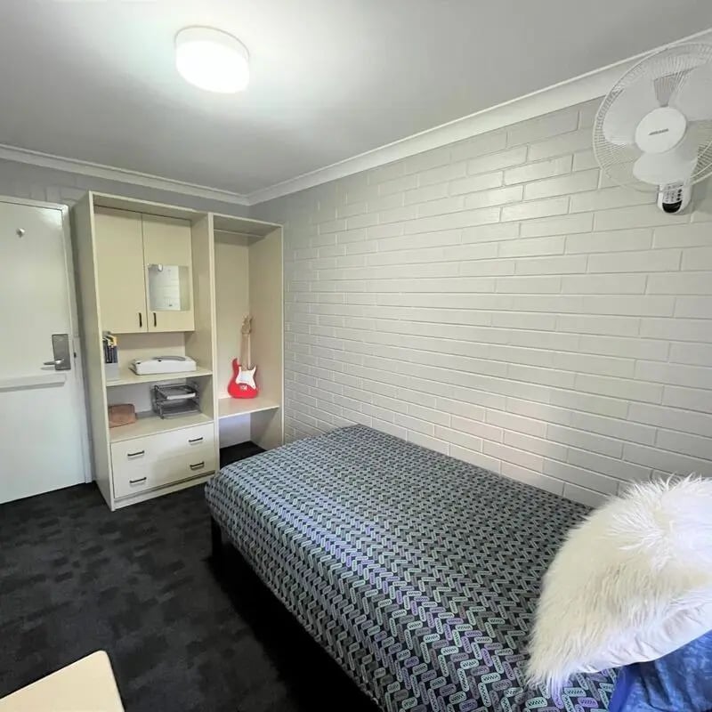 Bed wardrobe guitar fan bedroom at ECU Villlage Mount Lawley in Perth Student Accommodation
