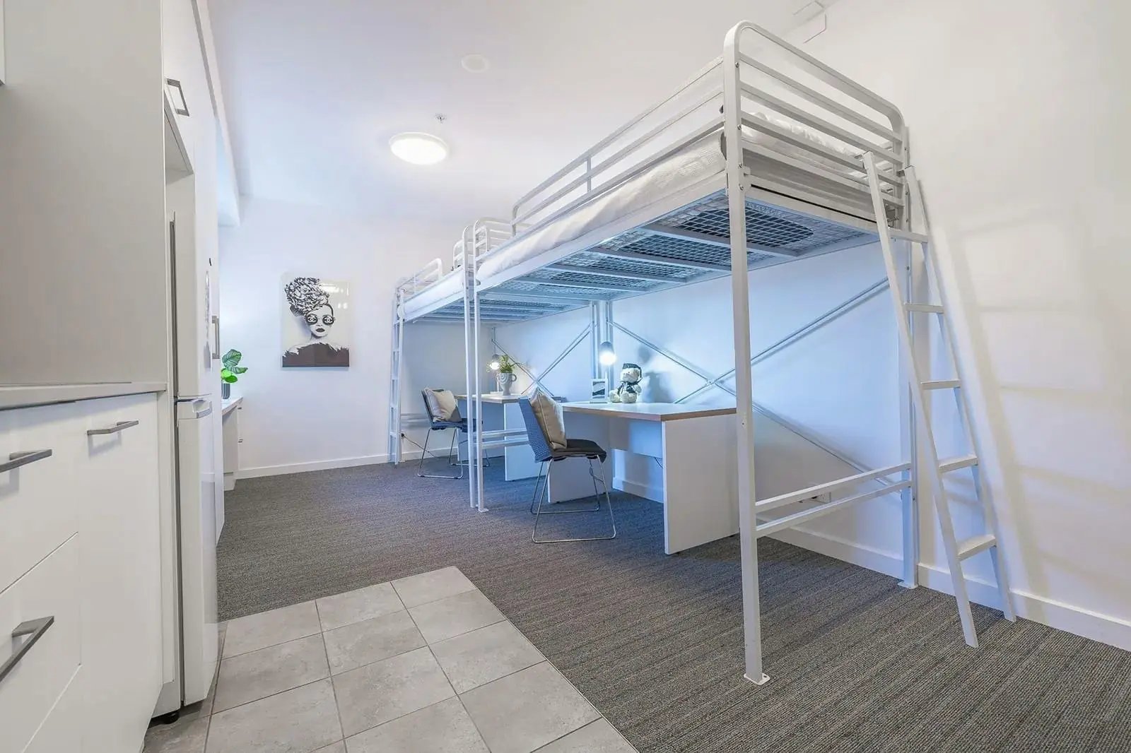 Loft beds with desks under them bedroom at dwell East End Adelaide in Adelaide Student Accommodation