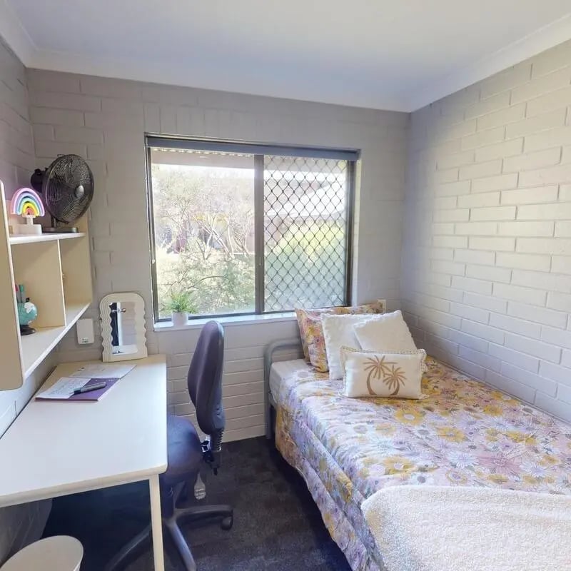Desk bed fan and chair student bedroom at Murdoch University Village in Perth Student Accommodation