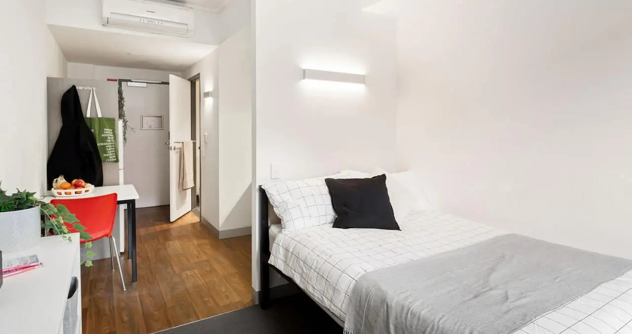Bed desk and coat rack bedroom at Iglu Broadway in Sydney Student Accommodation