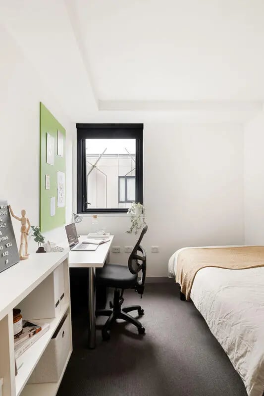 Desk chair laptop bed white shelf bedroom at Iglu Broadway in Sydney Student Accommodation